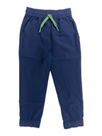Navy boys pants with a green drawstring on a white background