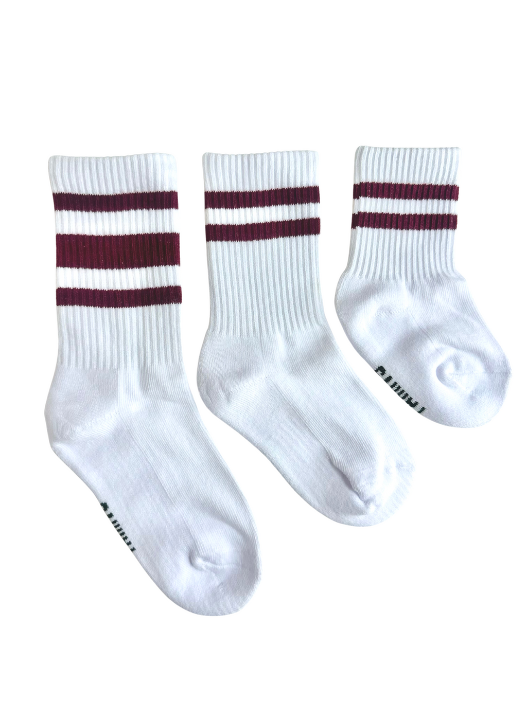 Three white boys socks with maroon stripes on a white background
